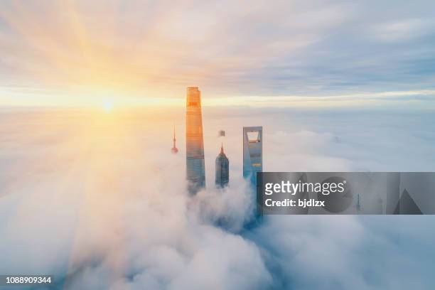 aerial view of shanghai at sunrise - shanghai stock pictures, royalty-free photos & images