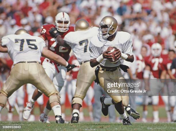 Tony Rice, Quarterback for the Notre Dame Fighting Irish runs the play during the NCAA Independent college football game against the Stanford...