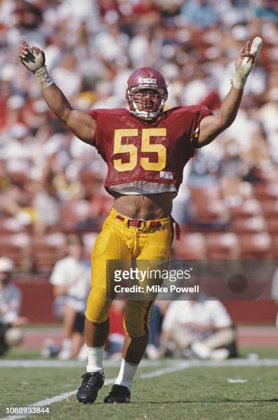 Junior Seau, Linebacker for the University of Southern California USC Trojans raises both arms in triumph during the NCAA Pac-10 Conference college...