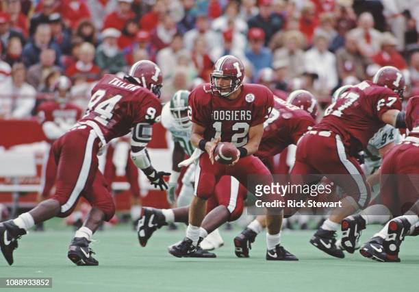 Trent Green, Quarterback for the University of Indiana Hoosiers hands the ball off to Running Back Corey Taylor during the NCAA Big Ten Conference...