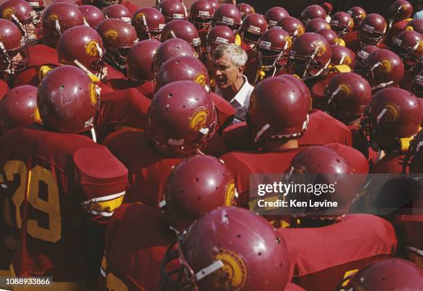 Larry Smith, Head Coach for the University of Southern California USC Trojans gathers his team around him for a pre game talk before the NCAA Pac-10...
