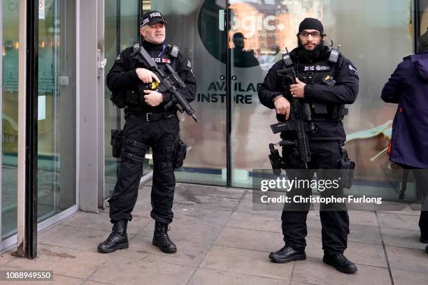 Armed police patrol Manchester's Piccadilly Station during heightened security after the stabbing on Monday at nearby at Victoria Station on January...