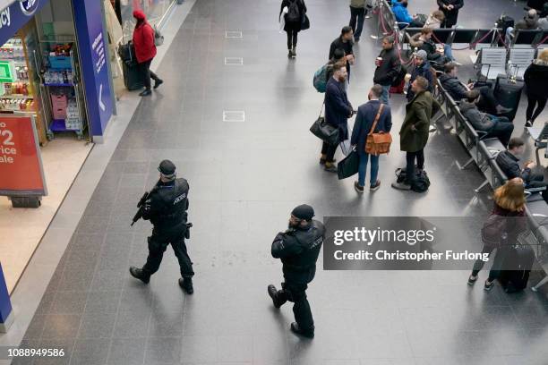 Armed police patrol Manchester's Piccadilly Station during heightened security after the stabbing on Monday at nearby at Victoria Station on January...