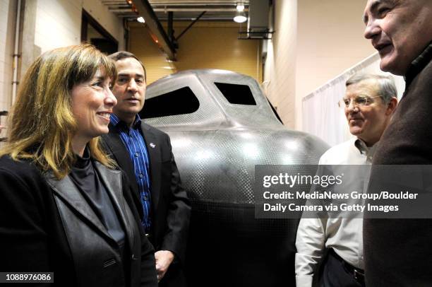 Deputy Administrator Lori Garver, left, and Mark Sirangelo, of Sierra Nevada Space Systems, talk with Jim Voss and Jeff Forbs, of the University of...