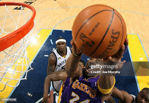 Kobe Bryant of the Los Angeles Lakers shoots a layup against Zach Randolph of the Memphis Grizzlies on February 7, 2011 at FedExForum in Memphis,...