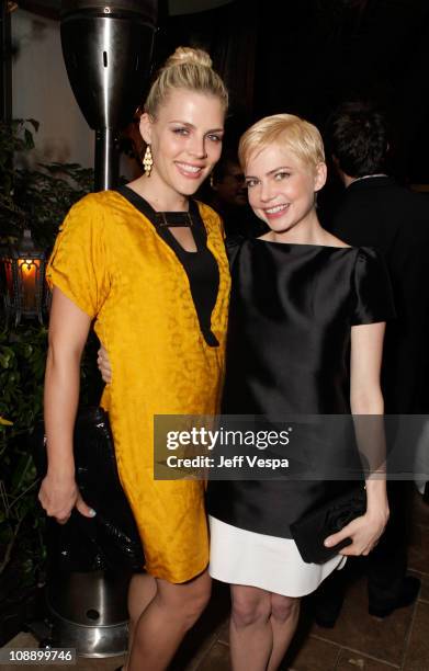 Actresses Busy Phillips and Michelle Williams attend the Audi celebrates "The King's Speech" awards season party held at Chateau Marmont on February...
