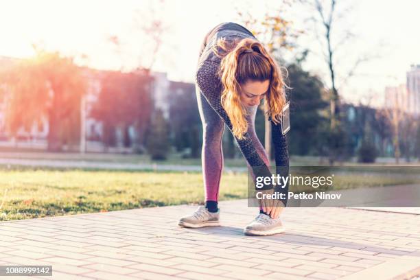 woman injuring foot while training - human foot anatomy stock pictures, royalty-free photos & images