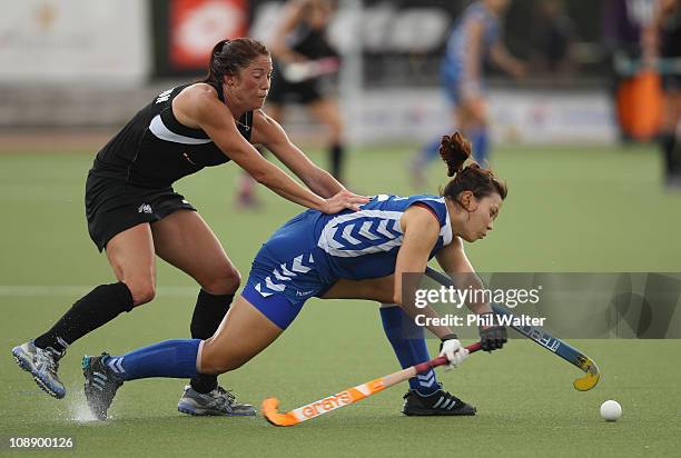 Krystal Forgesson of New Zealand tackles Soo Ji Jang of Korea during the Women's match between the New Zealand Blacksticks and Korea at the Rosvall...