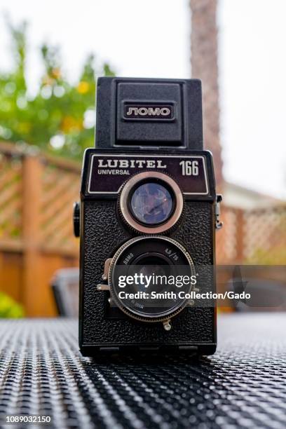 Close-up of the Soviet made Lubitel 166 Universal Twin Lens Reflex vintage camera from the original LOMO brand on a metal surface, December 20, 2018.