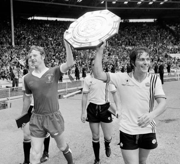 David Fairclough of Liverpool and Manchester United striker Stuart Pearson parade the FA Charity Shield after a 0-0 draw at Wembley Stadium, London...