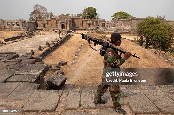 Cambodian solider guards the grounds of the 11th-century Preah Vihear temple as tensions remain high on both sides of the border, on February 8, 2011...
