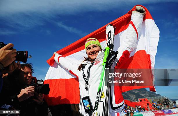 Elisabeth Goergl of Austria celebrates at the flower ceremony after finishing first while competing in the Women's Super G during the Alpine FIS Ski...