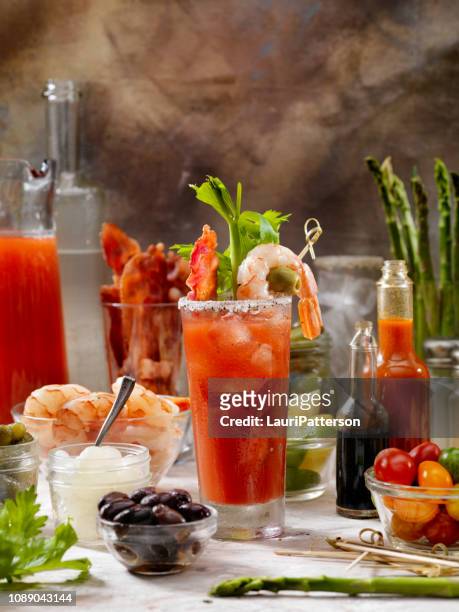 build your own bloody mary bar with, bacon, shrimp,celery, asparagus. - bloody mary stock pictures, royalty-free photos & images