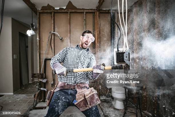 contractor man doing home improvement and demolition - destruction stock pictures, royalty-free photos & images