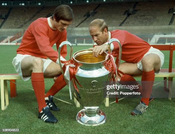 Jimmy Ryan and Bobby Charlton of Manchester United looking at the European Cup at Old Trafford, Manchester, July 1968.