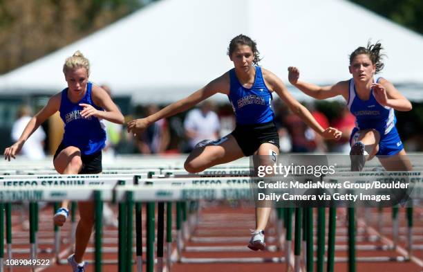 Broomfield's Kayla Wein, middle, leads teammate Ashley Miknis, left, and Longmont's Elizabeth Stover in the girl's 100 meter hurdles for the state...