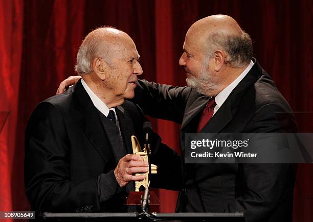 Director Carl Reiner presents an award to son director Rob Eeiner onstage at AARP Magazine's "10th Annual Movies For Grownups" at the Beverly...