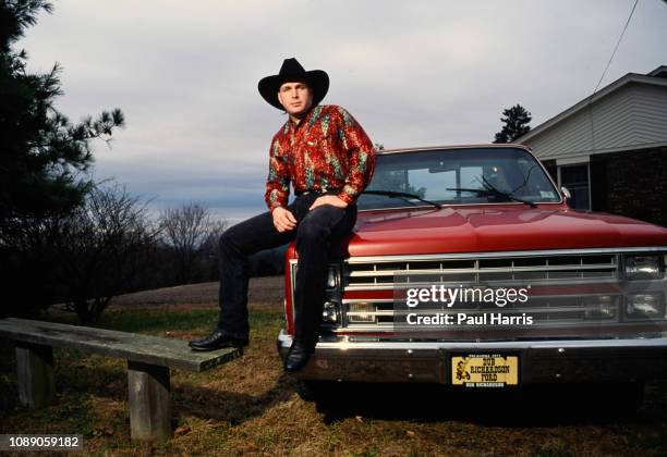 Garth Brooks sits on his Chevy truck which he drove to Nashville in at the start of his career, now parked at his Nashville Home January 1, 1992 in...