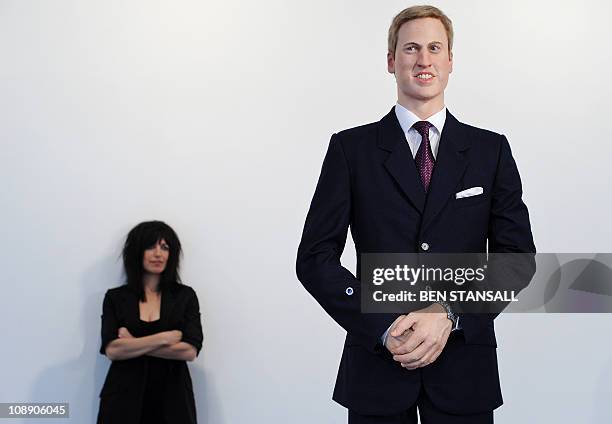 Artist Jennifer Rubell poses with her work of art entitled 'Engagement' depicting a life-sized wax model of Britain's Prince William with a replica...