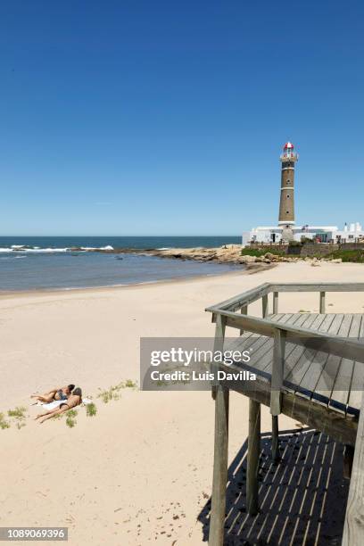 beach and lighthouse. jose ignacio. uruguay - jose ignacio lighthouse fotografías e imágenes de stock