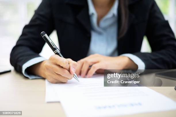 business woman signing documents . deal concept. - forms stock-fotos und bilder