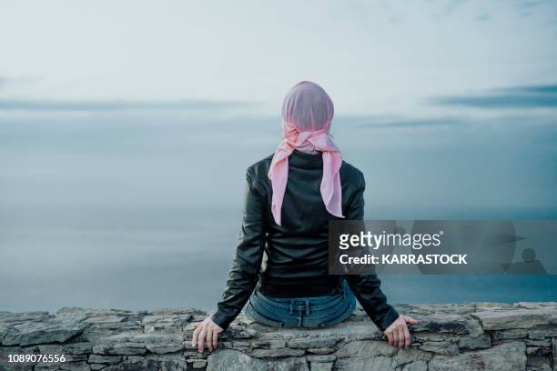 woman with pink headscarf, has cancer - cancer prevention stock pictures, royalty-free photos & images