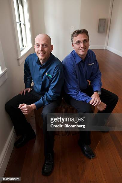 Lyndon Rive, co-founder and chief executive officer of SolarCity, left, and Peter Rive, fellow co-founder and chief operating officer, sit for a...