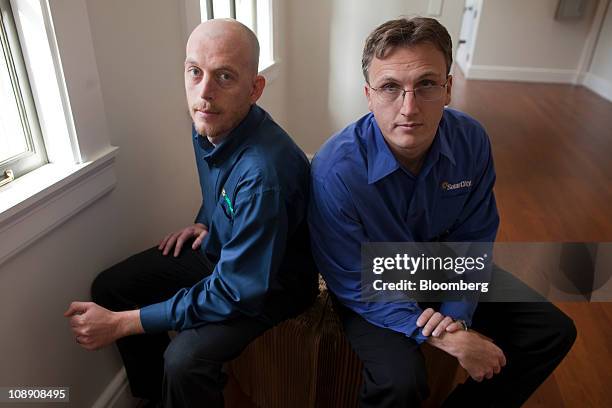 Lyndon Rive, co-founder and chief executive officer of SolarCity, left, and Peter Rive, fellow co-founder and chief operating officer, sit for a...