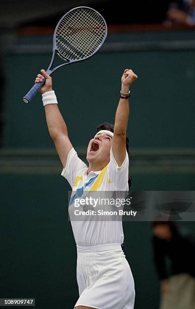 Arantxa Sanchez Vicario of Spain raises her arms in celebration after defeating Lori McNiel in the their Women's Singles match at the Wimbledon Lawn...