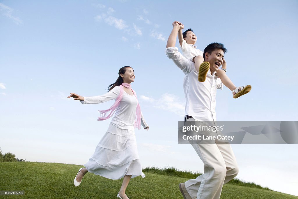 A young family enjoying the park