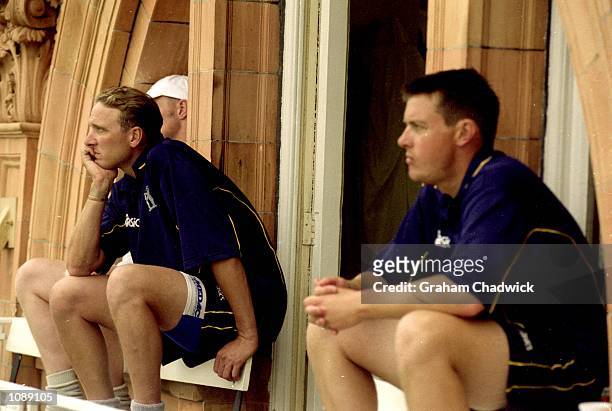 Allan Donald and Ashley Giles of Warwickshire wait for play to start during the Natwest Cup Final against Gloucestershire at Lord's in London....