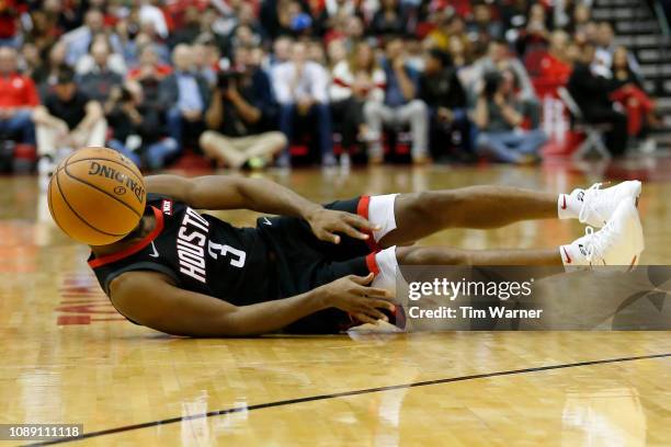 Chris Paul of the Houston Rockets dives for a loose ball in the second half against the Utah Jazz at Toyota Center on December 17, 2018 in Houston,...