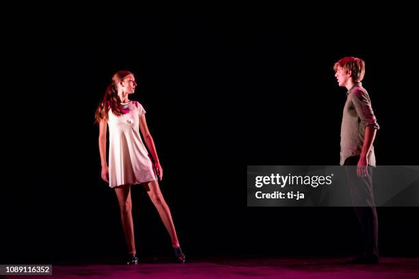 young dancers performing on a theater stage - acting performance stock pictures, royalty-free photos & images