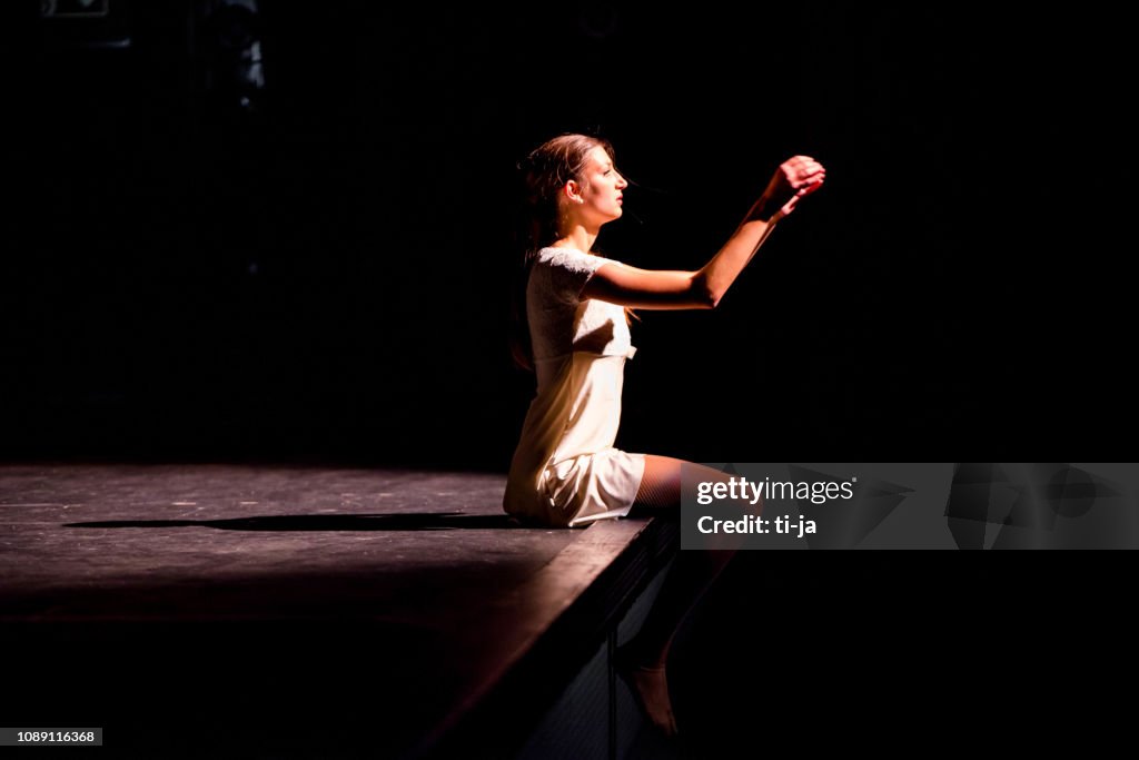 Young dancer performing on a theater stage