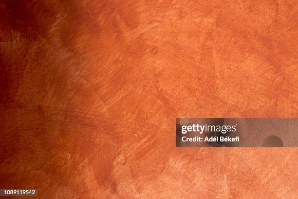 orange plastered rusty concrete wall - cobre fotografías e imágenes de stock