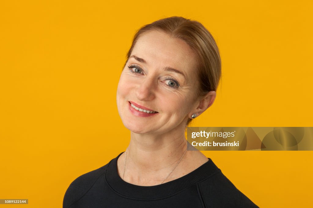 Studio portrait of a 55 year old woman