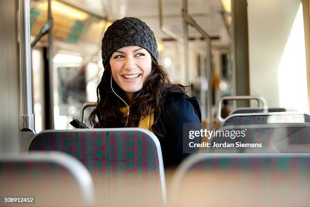 woman using streetcar in city. - öffentliches verkehrsmittel stock-fotos und bilder