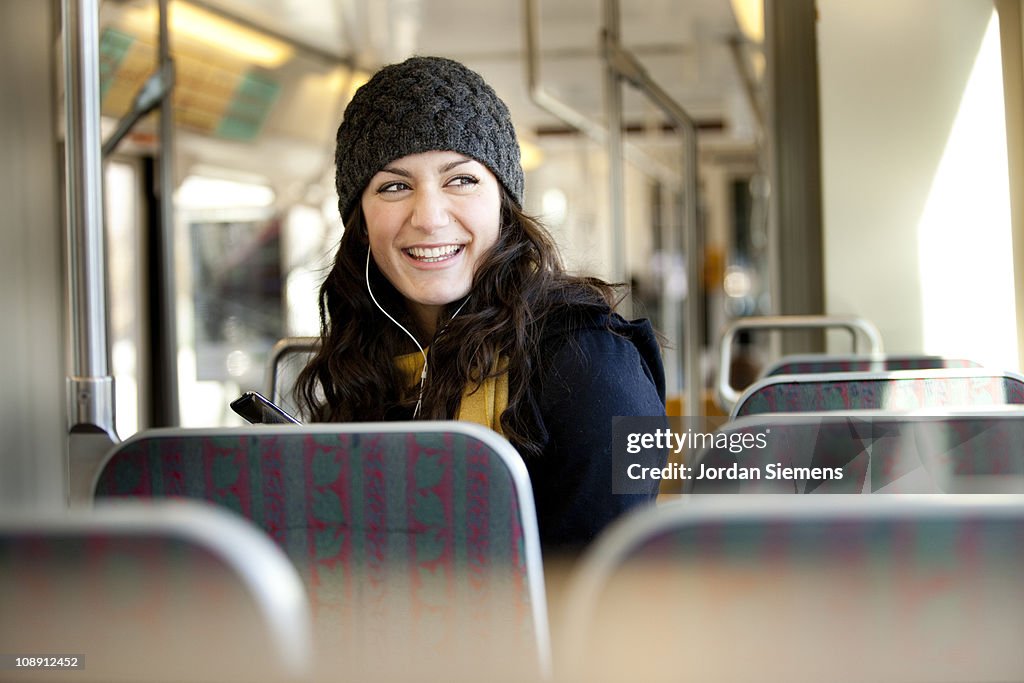 Woman using streetcar in city.