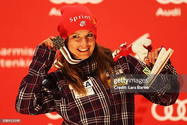 Julia Mancuso of the United States of America collects her silver medal at the medal plaza for finishing second in the Women's Super G during the...