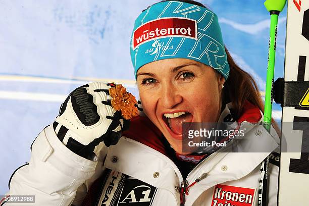 Elisabeth Goergl of Austria celebrates with her gold medal after finishing first in the Women's Super G during the Alpine FIS Ski World Championships...