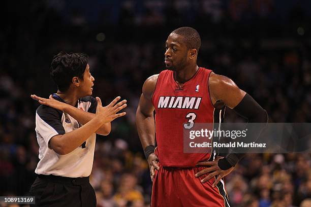 Referee Violet Palmer and Dwyane Wade of the Miami Heat at Ford Center on January 30, 2011 in Oklahoma City, Oklahoma. NOTE TO USER: User expressly...