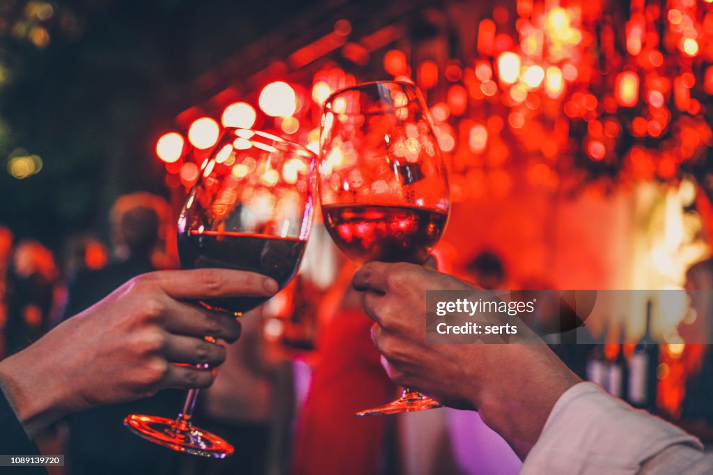 Couple toasting wine glasses