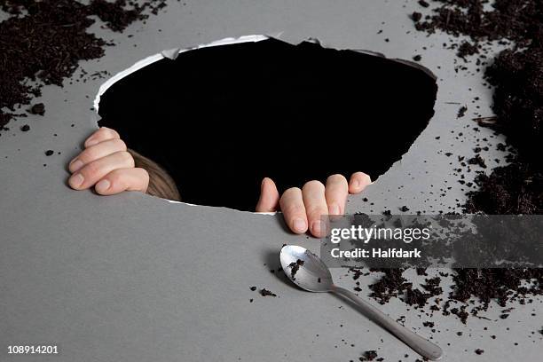 detail of a person in a hole - earth internal structure stock pictures, royalty-free photos & images