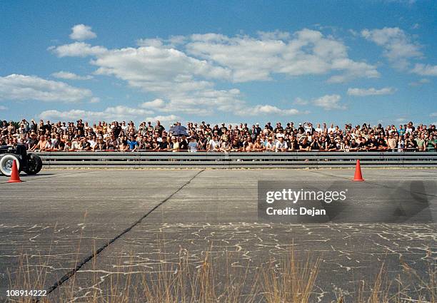 view of a crowd at a race track - bleachers stock-fotos und bilder