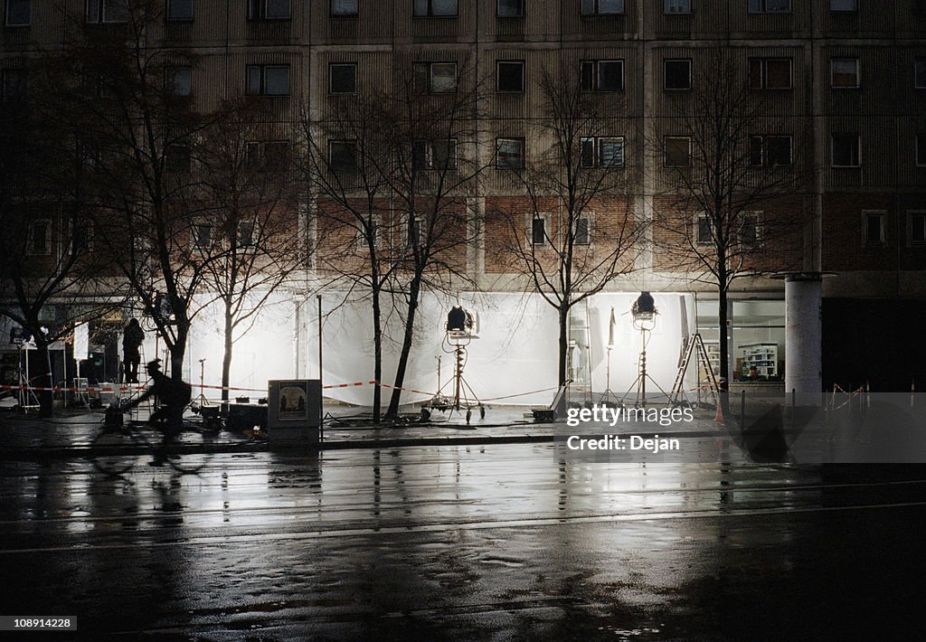 A film set on a city street at night