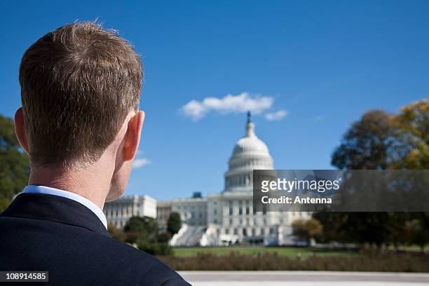 a politician in front of the us capitol building - representative member of congress stock-fotos und bilder