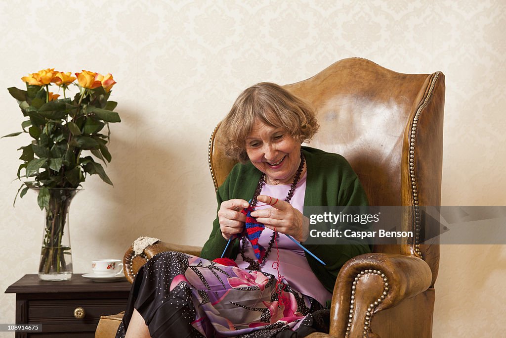 A senior woman enjoying knitting