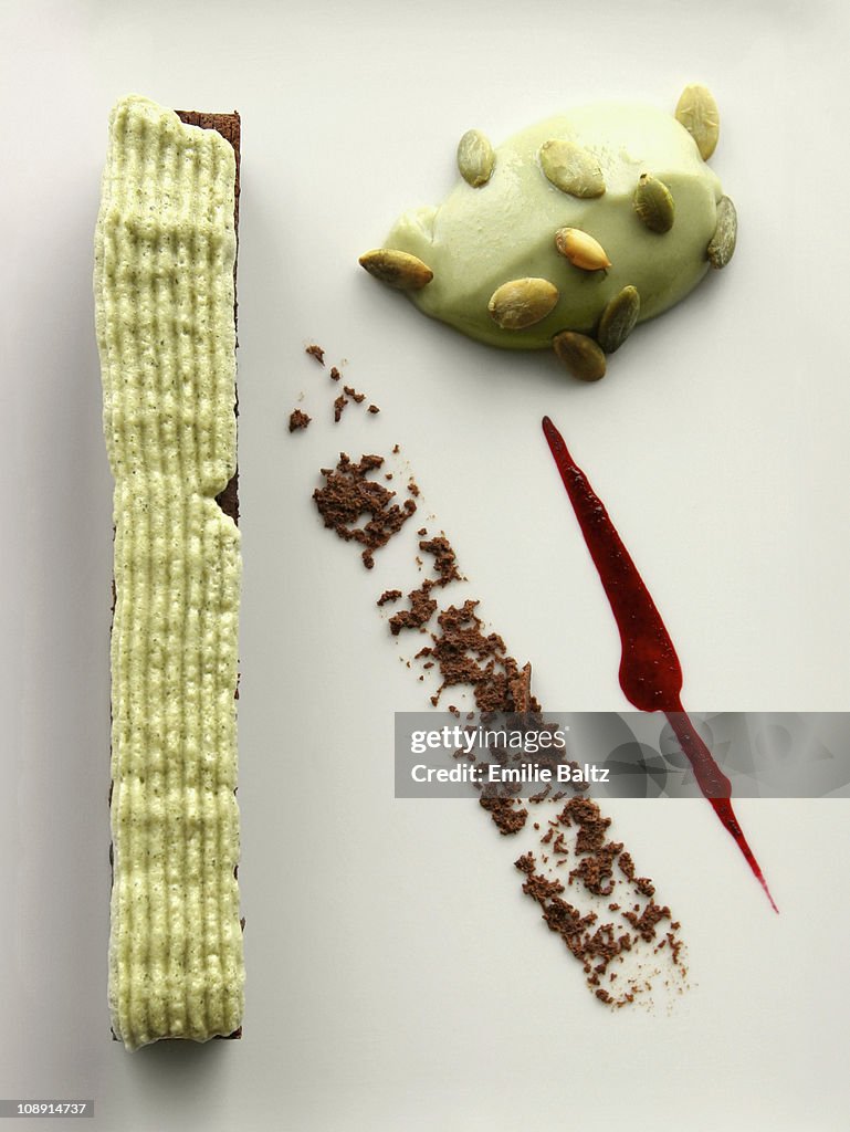 Chocolate cake with pistachio foam and pistachio custard dessert