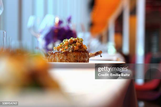 a lamb cutlet with carrot salsa on a plate - dining presentation food stock-fotos und bilder