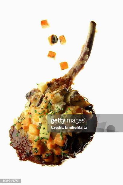 a lamb cutlet with carrot salsa on a lightbox - lamb cutlets bildbanksfoton och bilder